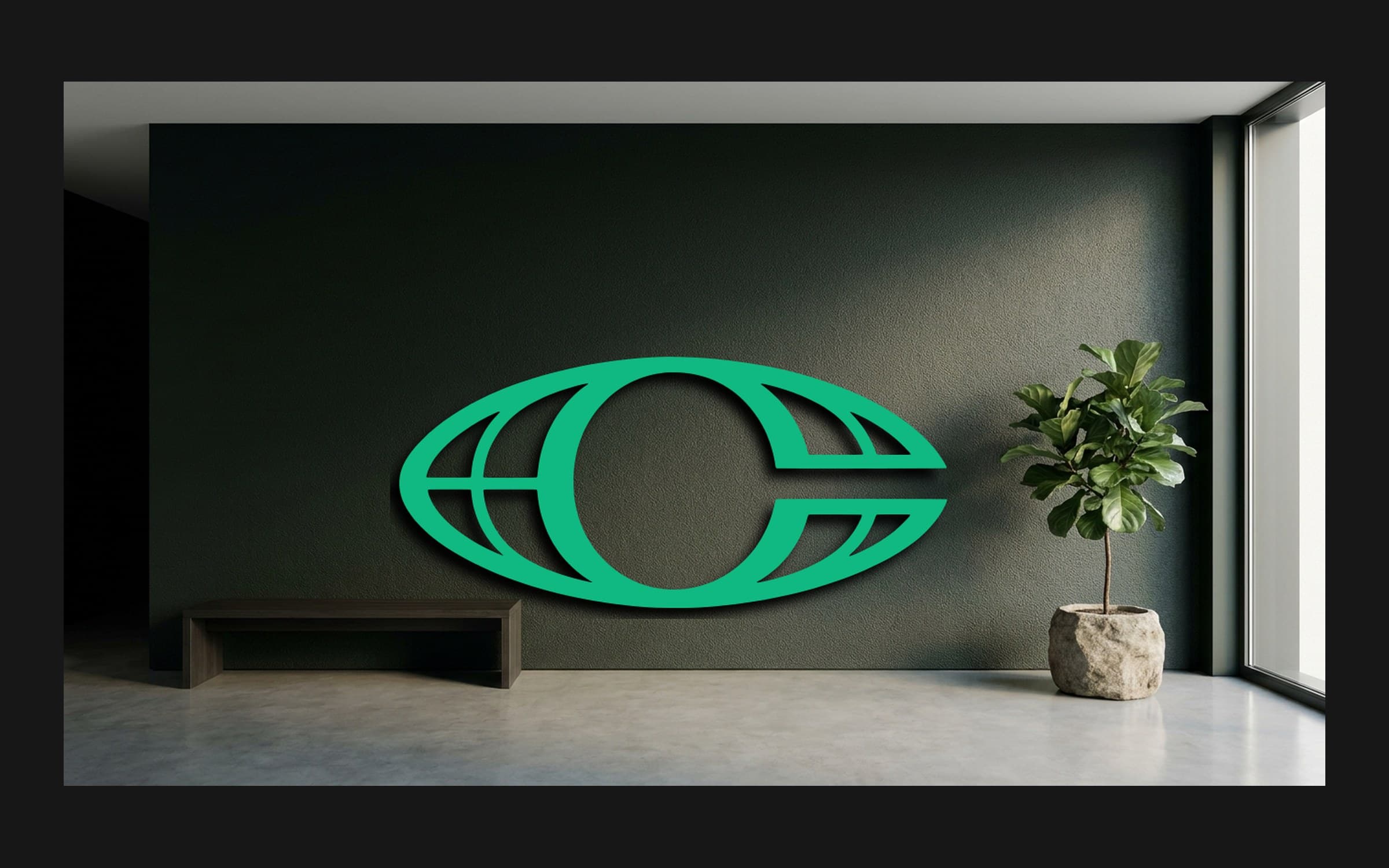 Mockup of a large emerald Criterium isotipo mounted on a dark green office wall next to a bench and a potted tree