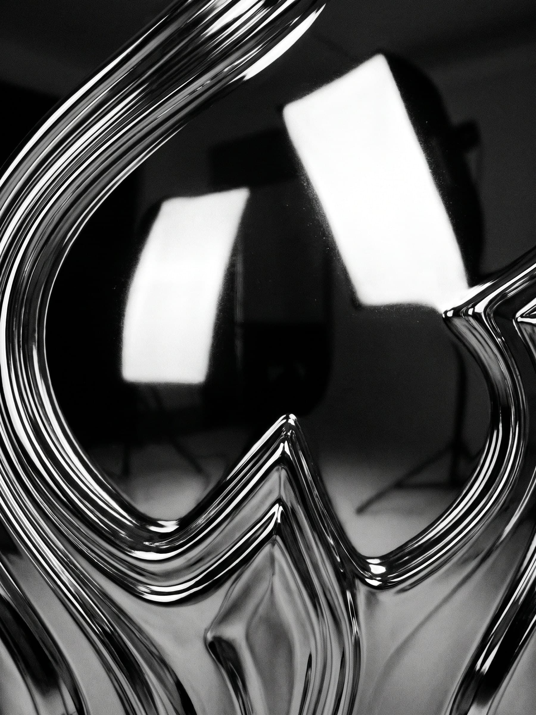 Macro of liquid chrome with pointed ridges reflecting studio lights